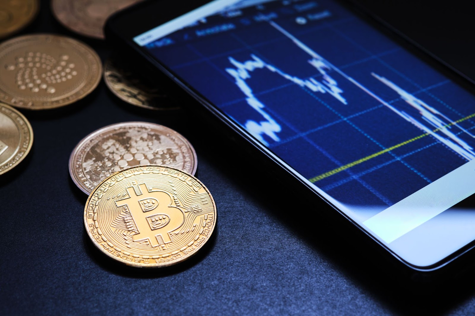 crypto coins and a phone