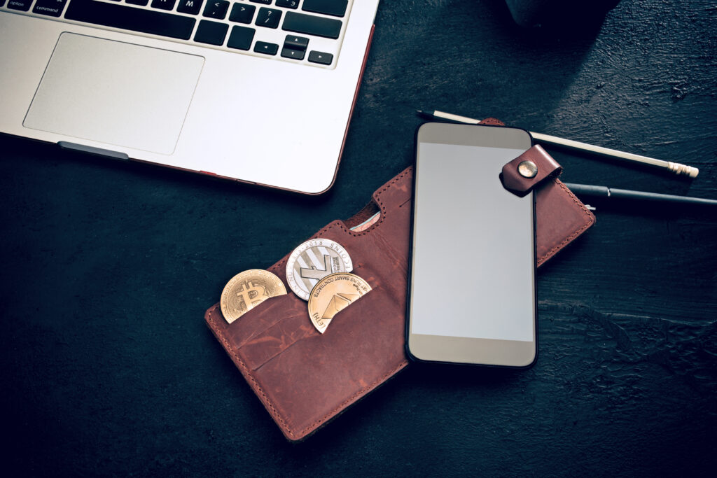The golden bitcoin, mobile phone, keyboard, credit card.