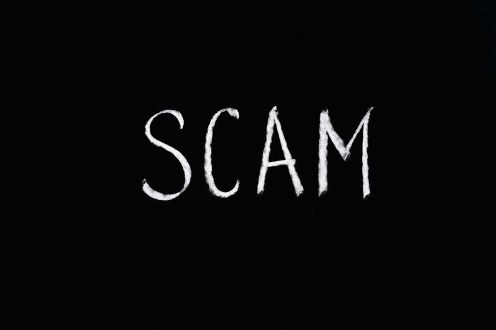 Scam boldly inscribed on a black background