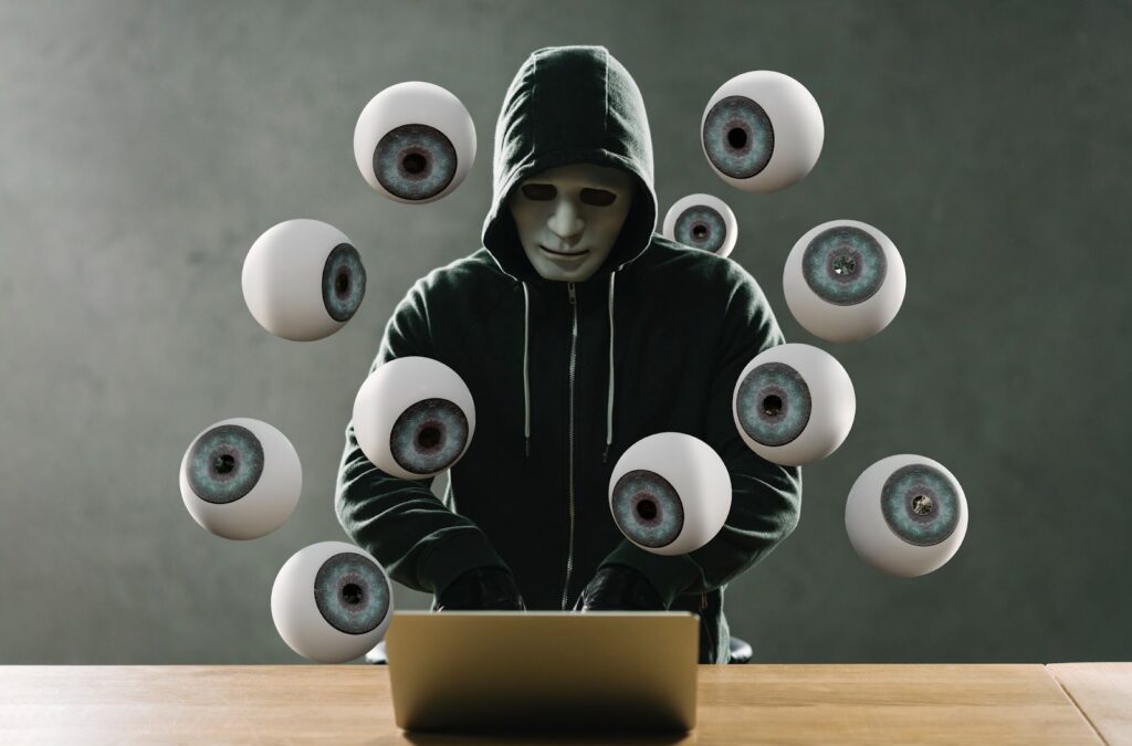 Multiple eyes looking into the computer of a scammer