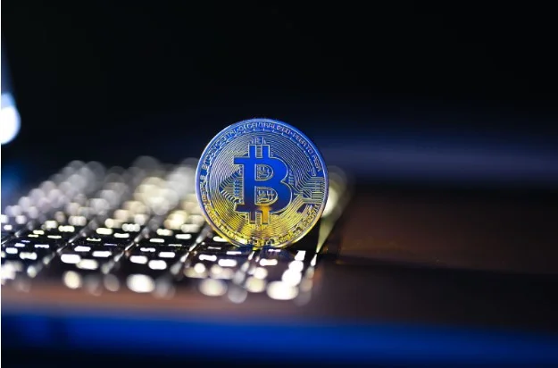 Crypto coin on Blurred Keyboard