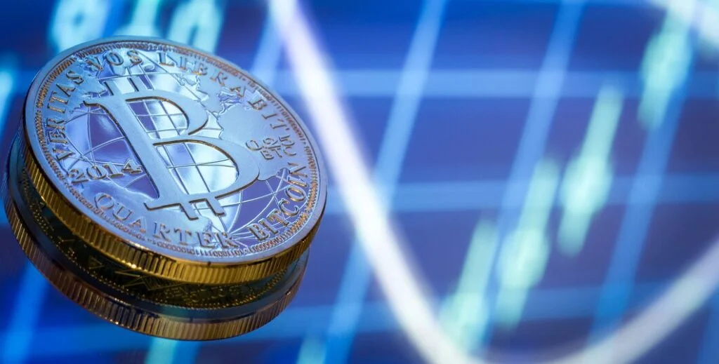 Crypto coins on blurred graph background