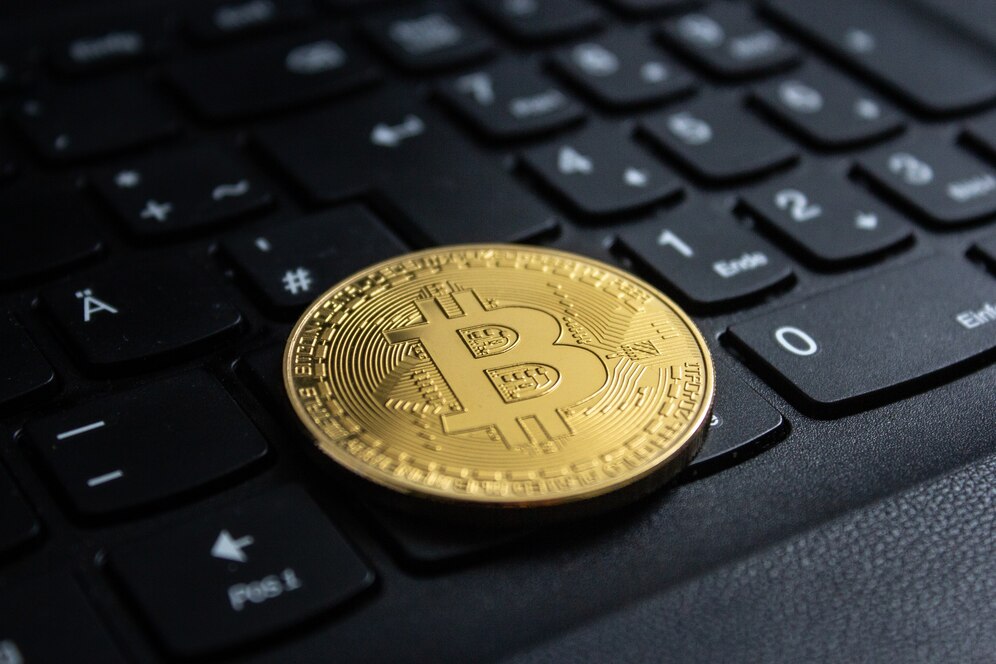 Crypto coin on laptop keyboard