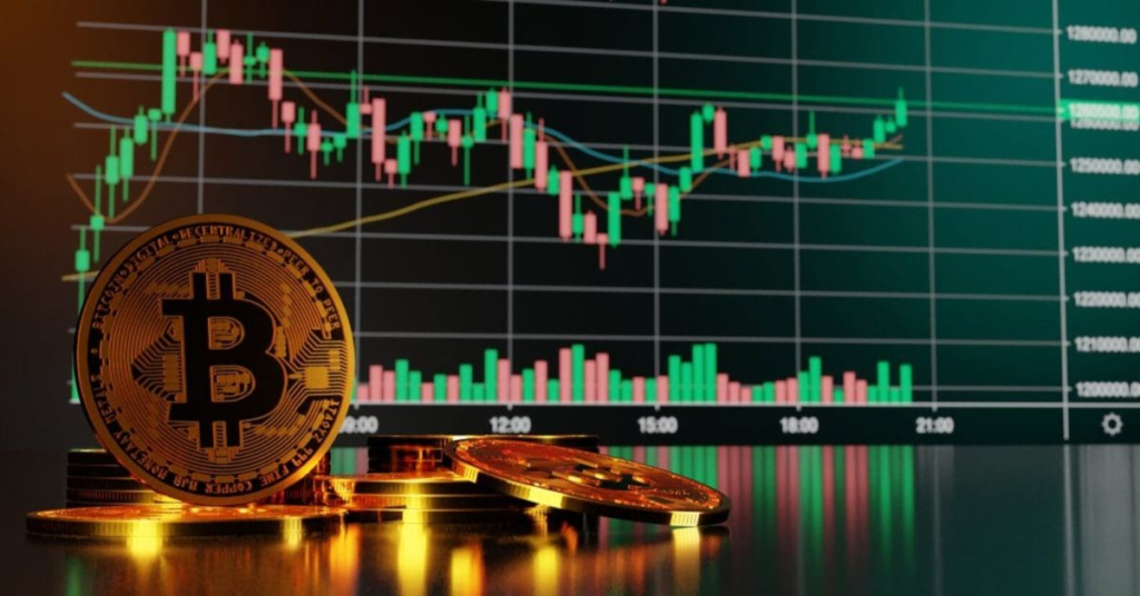 Bitcoin coin in front of a cryptocurrency trading chart showing price fluctuations and volume