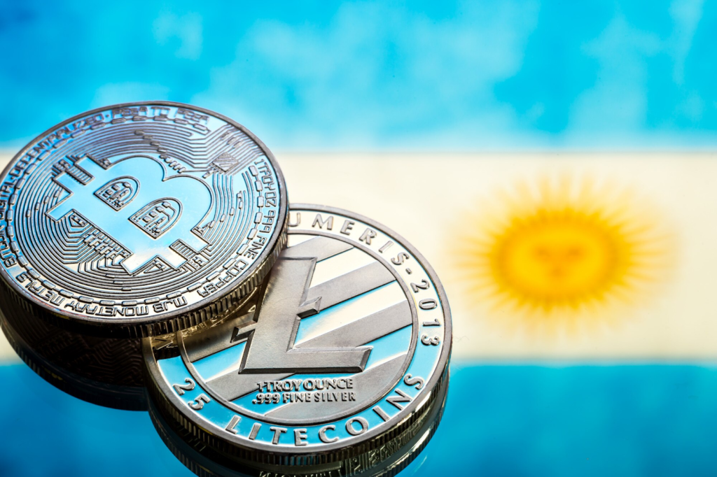 two silver-colored cryptocurrency coins placed on top of each other