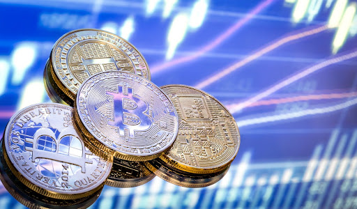 Crypto coins on blurred chart background