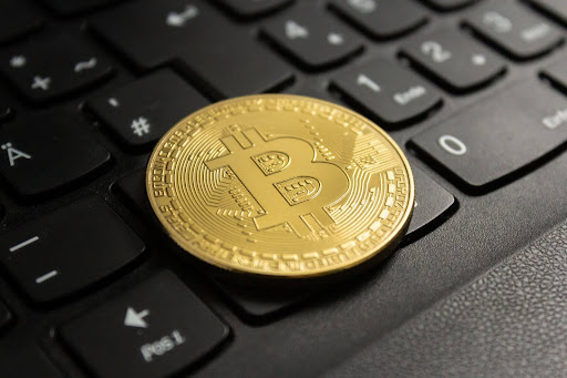 Crypto coin on black computer keyboard