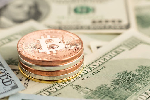 Crypto coin pile on banknotes