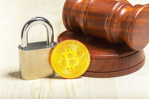 Crypto coin with padlock and gravel Golden Bitcoin Cryptocurrency