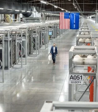 A person walking in a Bitcoin mining facility